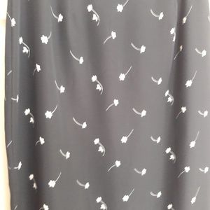 Long Black Skirt with Small White Flower Details